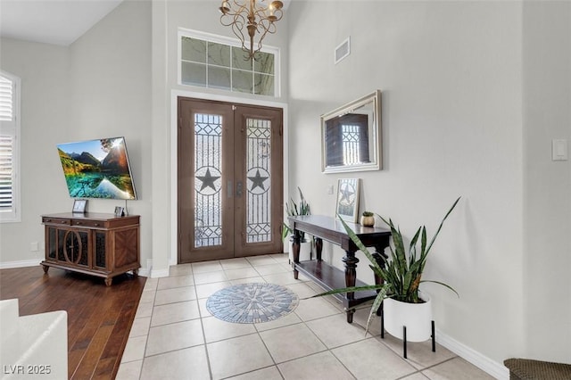 4326 Spooner Lake Cir, Las Vegas, NV 89147 - foyer with french doors, a high ceiling, a chandelier, and baseboards