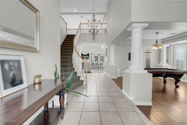 4326 Spooner Lake Cir, Las Vegas, NV 89147 - foyer with stairway, decorative columns, pool table, a chandelier, and a high ceiling