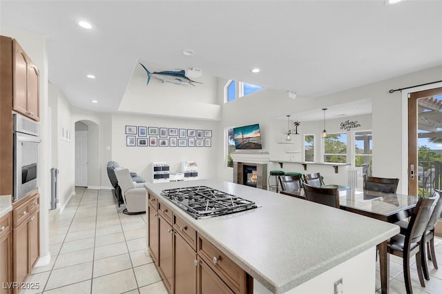 4326 Spooner Lake Cir, Las Vegas, NV 89147 - kitchen featuring open floor plan, stainless steel appliances, arched walkways, plenty of natural light, and recessed lighting