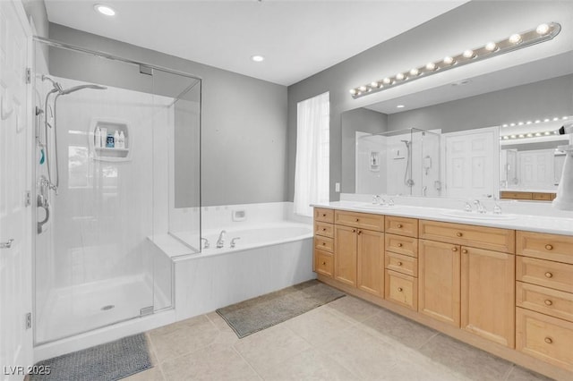 4326 Spooner Lake Cir, Las Vegas, NV 89147 - full bathroom with a shower stall, double vanity, a garden tub, tile patterned flooring, and recessed lighting