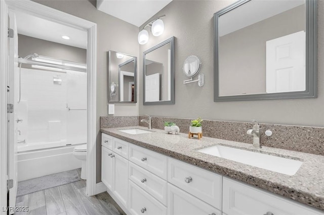4326 Spooner Lake Cir, Las Vegas, NV 89147 - bathroom featuring toilet, double vanity, and shower / bath combination with glass door