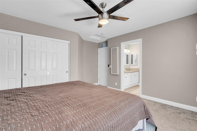4326 Spooner Lake Cir, Las Vegas, NV 89147 - unfurnished bedroom with a closet, baseboards, light colored carpet, ceiling fan, and connected bathroom