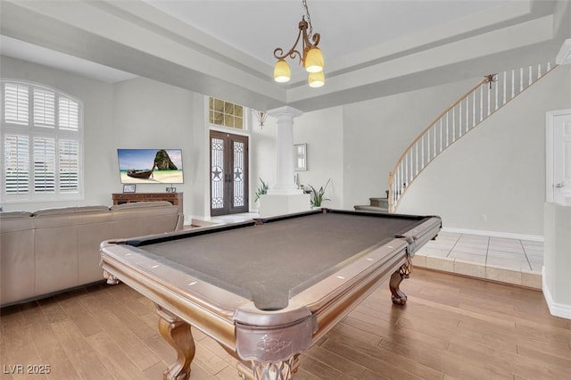 4326 Spooner Lake Cir, Las Vegas, NV 89147 - playroom with ornate columns, wood finished floors, a raised ceiling, and french doors