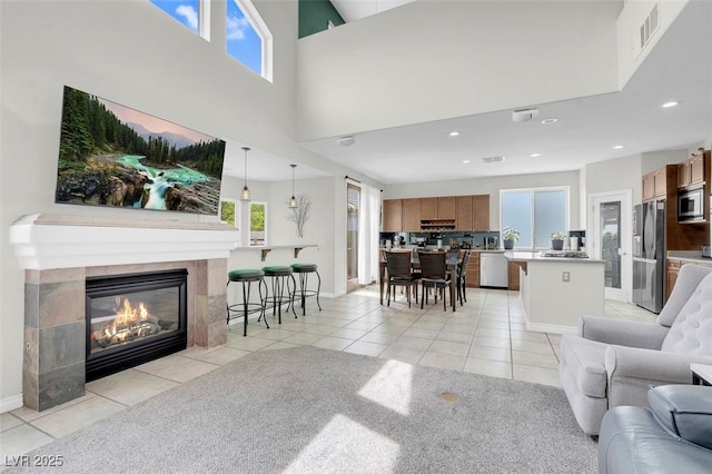 4326 Spooner Lake Cir, Las Vegas, NV 89147 - living room featuring light tile patterned floors, a fireplace, recessed lighting, and baseboards