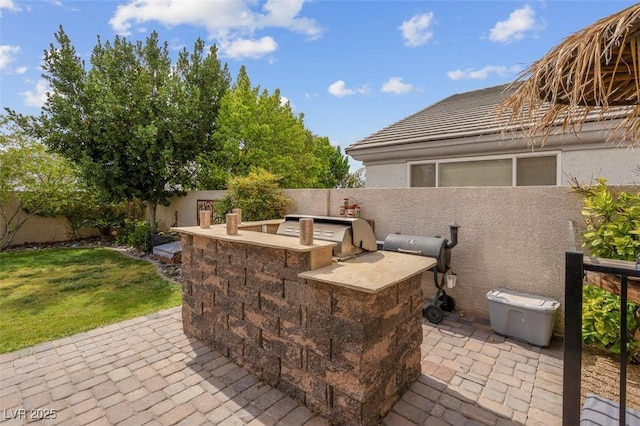 4326 Spooner Lake Cir, Las Vegas, NV 89147 - fenced backyard with a patio and a garage