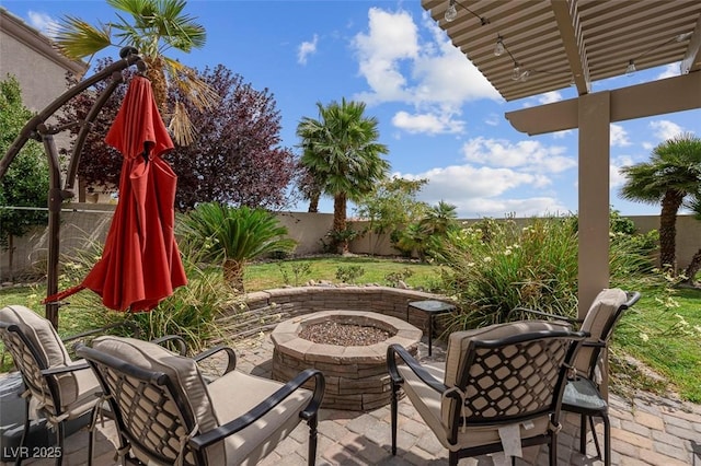 4326 Spooner Lake Cir, Las Vegas, NV 89147 - fenced backyard with an outdoor fire pit and a patio area