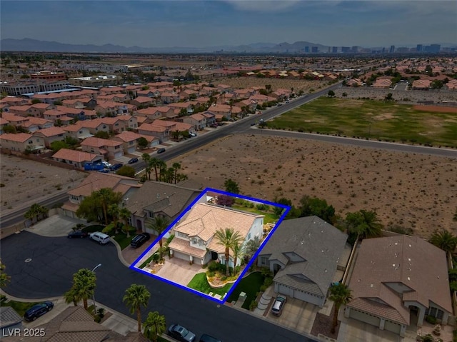 4326 Spooner Lake Cir, Las Vegas, NV 89147 - aerial perspective of suburban area featuring a mountain backdrop and property parcel outlined