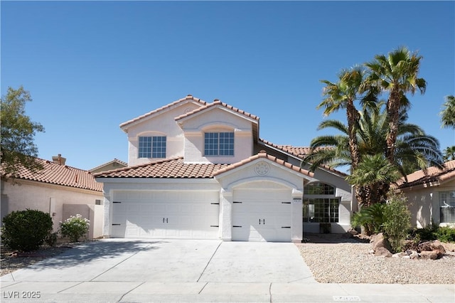 7825 Desert Bell Ave, Las Vegas, NV 89128 - mediterranean / spanish house featuring a tiled roof, stucco siding, a garage, and concrete driveway