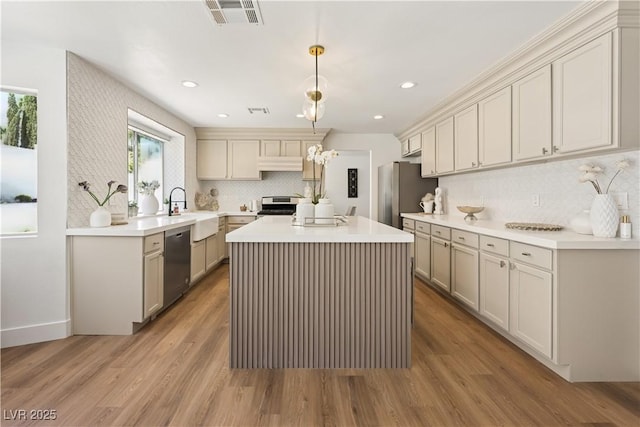 7825 Desert Bell Ave, Las Vegas, NV 89128 - kitchen with appliances with stainless steel finishes, under cabinet range hood, a sink, decorative backsplash, and recessed lighting
