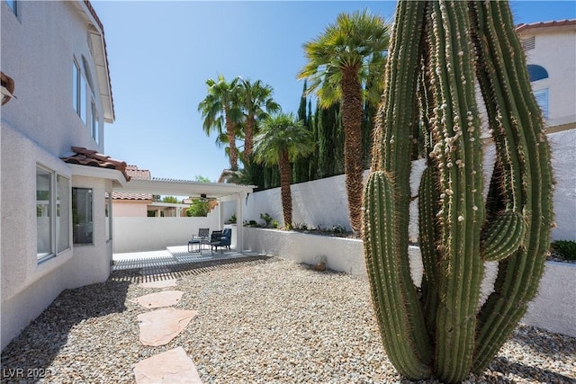 7825 Desert Bell Ave, Las Vegas, NV 89128 - fenced backyard with a patio area