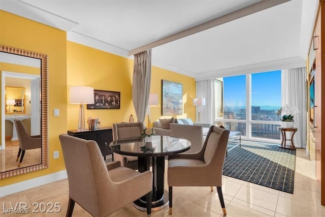 2000 N Fashion Show Dr Unit 5326, Las Vegas, NV 89109 - dining area featuring a wall of windows, tile patterned flooring, and baseboards