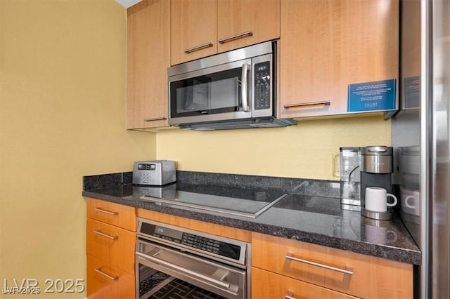 2000 N Fashion Show Dr Unit 5326, Las Vegas, NV 89109 - kitchen with stainless steel appliances and dark stone counters