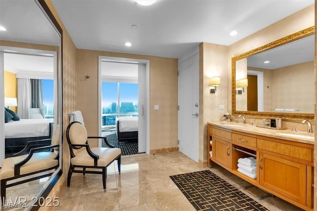 2000 N Fashion Show Dr Unit 5326, Las Vegas, NV 89109 - full bathroom featuring connected bathroom, double vanity, baseboards, and recessed lighting