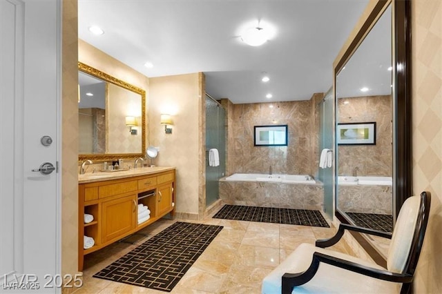 2000 N Fashion Show Dr Unit 5326, Las Vegas, NV 89109 - full bathroom with double vanity, a garden tub, a shower stall, and recessed lighting