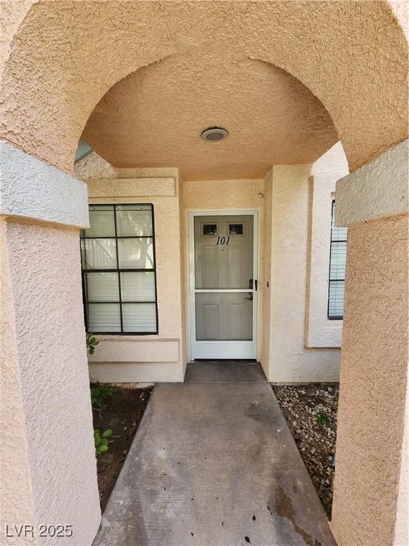 4805 S Torrey Pines Dr Unit 101, Las Vegas, NV 89103 - view of exterior entry featuring stucco siding