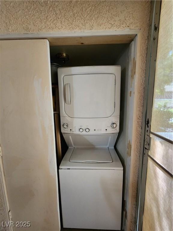 4805 S Torrey Pines Dr Unit 101, Las Vegas, NV 89103 - washroom with stacked washer / dryer