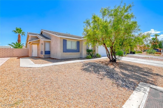 2103 Falcon Crest Ave, North Las Vegas, NV 89031 - ranch-style house with stucco siding and an attached garage