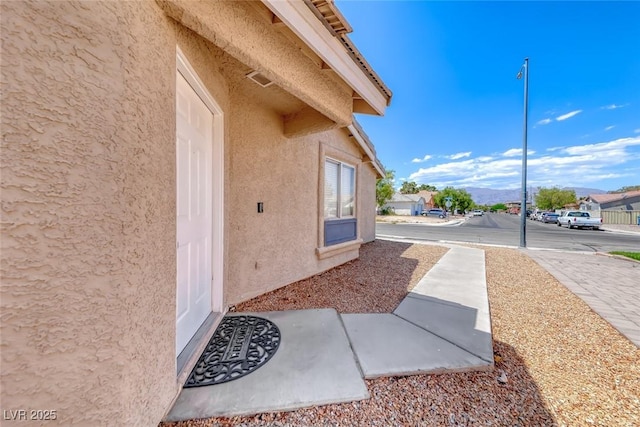 2103 Falcon Crest Ave, North Las Vegas, NV 89031 - entrance to property with stucco siding