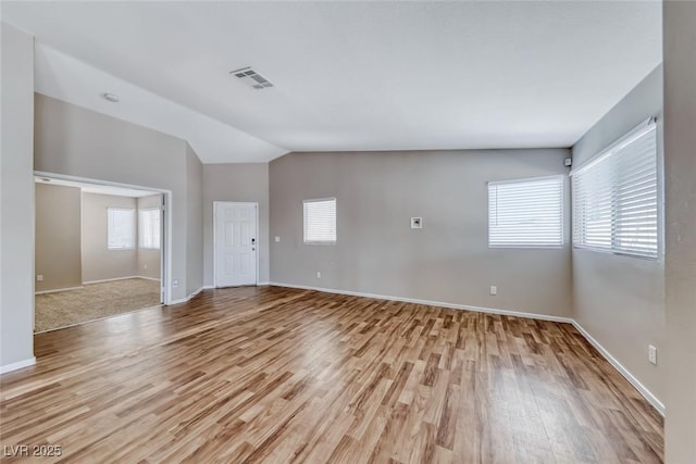 2103 Falcon Crest Ave, North Las Vegas, NV 89031 - unfurnished room featuring light wood finished floors, baseboards, and lofted ceiling