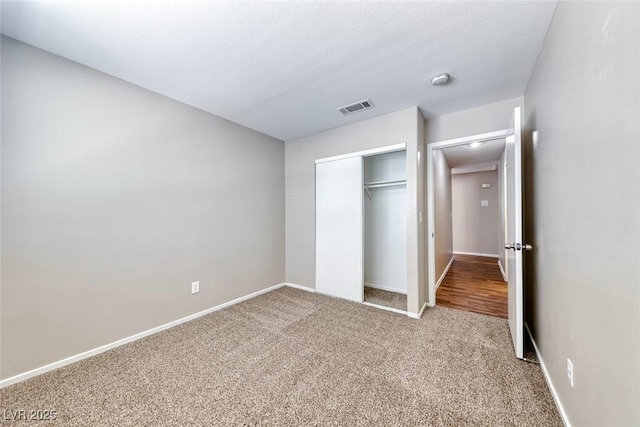 2103 Falcon Crest Ave, North Las Vegas, NV 89031 - unfurnished bedroom with carpet, a closet, and baseboards