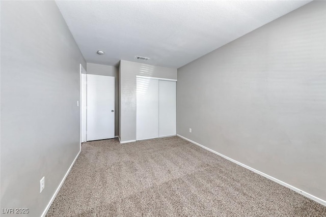 2103 Falcon Crest Ave, North Las Vegas, NV 89031 - unfurnished bedroom with carpet, baseboards, and a closet