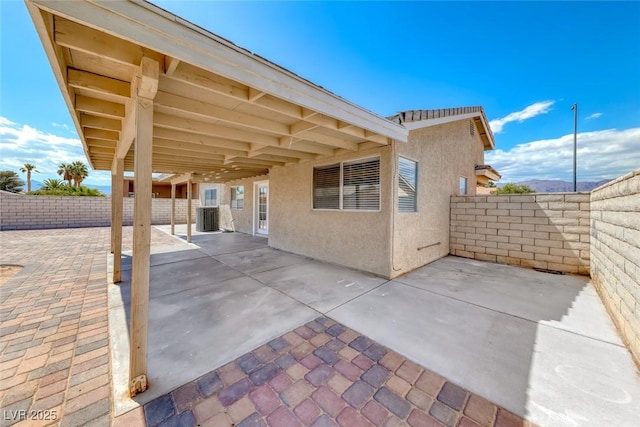 2103 Falcon Crest Ave, North Las Vegas, NV 89031 - fenced backyard featuring a patio and central AC unit