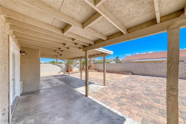 2103 Falcon Crest Ave, North Las Vegas, NV 89031 - fenced backyard with a patio