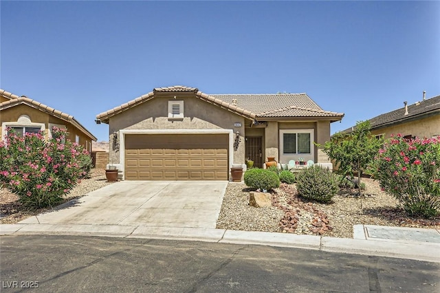 3642 Winter Whitetail St, Las Vegas, NV 89122 - mediterranean / spanish-style home featuring an attached garage, stucco siding, driveway, and a tile roof