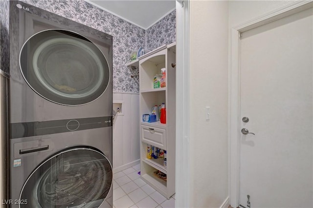 5725 N Durango Dr, Las Vegas, NV 89149 - laundry area featuring stacked washer / drying machine, wallpapered walls, tile patterned flooring, and wainscoting