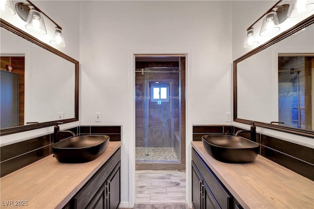 5725 N Durango Dr, Las Vegas, NV 89149 - bathroom featuring a stall shower and two vanities
