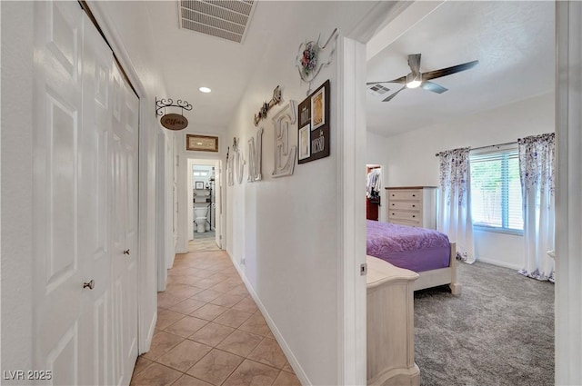 5725 N Durango Dr, Las Vegas, NV 89149 - corridor with baseboards, light tile patterned floors, recessed lighting, and light colored carpet