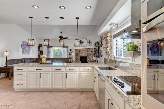 5725 N Durango Dr, Las Vegas, NV 89149 - kitchen with black electric cooktop, a sink, open floor plan, stainless steel dishwasher, and a ceiling fan