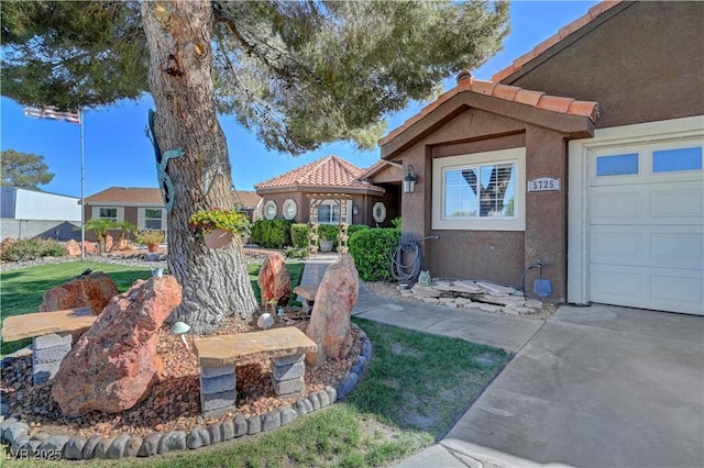 5725 N Durango Dr, Las Vegas, NV 89149 - view of yard featuring an attached garage and driveway