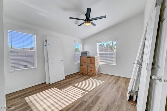 5725 N Durango Dr, Las Vegas, NV 89149 - bedroom with wood finished floors, baseboards, lofted ceiling, and a ceiling fan