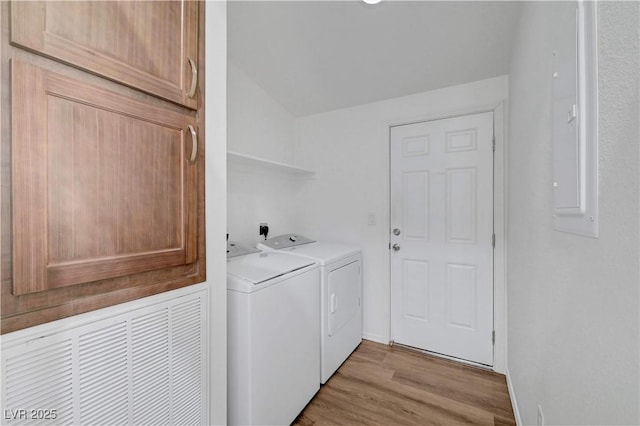 5725 N Durango Dr, Las Vegas, NV 89149 - laundry room with washing machine and dryer, light wood-style flooring, and baseboards