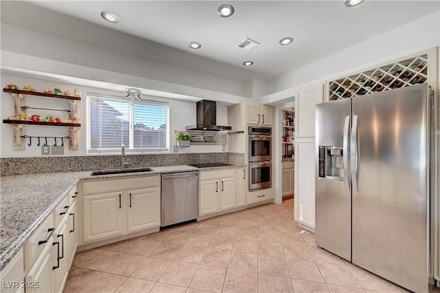 5725 N Durango Dr, Las Vegas, NV 89149 - kitchen with stainless steel appliances, a sink, wall chimney range hood, light stone countertops, and light tile patterned flooring