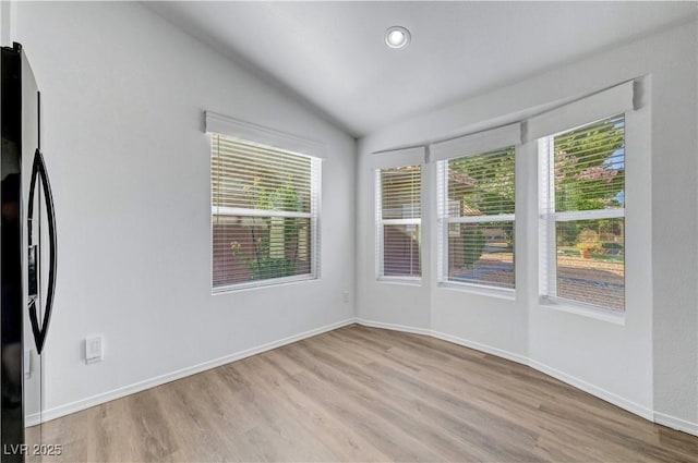 5725 N Durango Dr, Las Vegas, NV 89149 - unfurnished room with wood finished floors, vaulted ceiling, healthy amount of natural light, baseboards, and recessed lighting