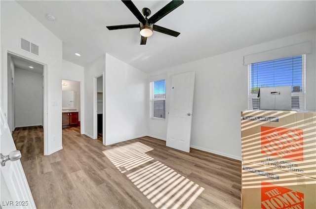 5725 N Durango Dr, Las Vegas, NV 89149 - unfurnished room featuring a ceiling fan, wood finished floors, baseboards, vaulted ceiling, and a smoke detector