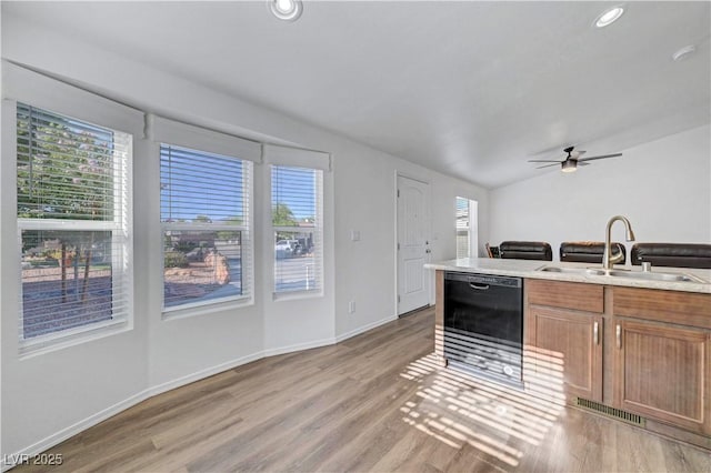5725 N Durango Dr, Las Vegas, NV 89149 - kitchen featuring black dishwasher, a sink, light wood-style flooring, ceiling fan, and recessed lighting