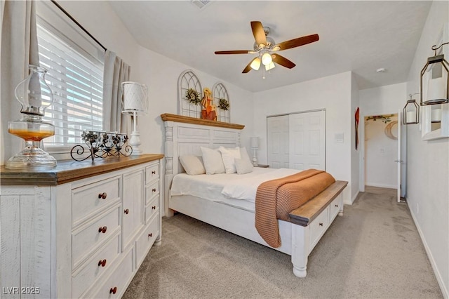5725 N Durango Dr, Las Vegas, NV 89149 - bedroom featuring light carpet, a closet, baseboards, and ceiling fan