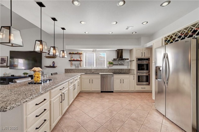 5725 N Durango Dr, Las Vegas, NV 89149 - kitchen with appliances with stainless steel finishes, wall chimney exhaust hood, a sink, hanging light fixtures, and recessed lighting