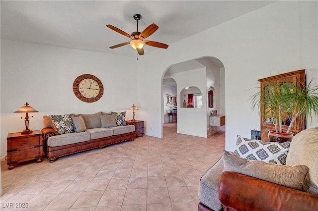 5725 N Durango Dr, Las Vegas, NV 89149 - living room featuring arched walkways, a ceiling fan, and light tile patterned floors