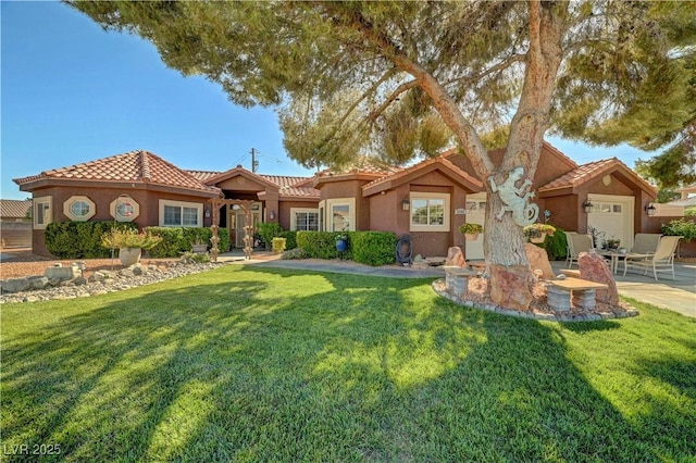 5725 N Durango Dr, Las Vegas, NV 89149 - mediterranean / spanish-style home featuring a front lawn, a tile roof, and stucco siding