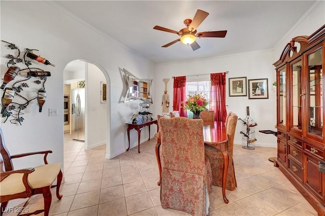 5725 N Durango Dr, Las Vegas, NV 89149 - dining room with ceiling fan, arched walkways, ornamental molding, and light tile patterned flooring