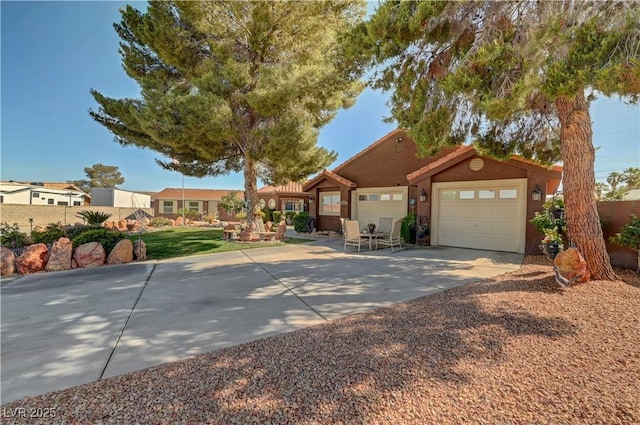5725 N Durango Dr, Las Vegas, NV 89149 - view of front of house with an attached garage, driveway, and stucco siding