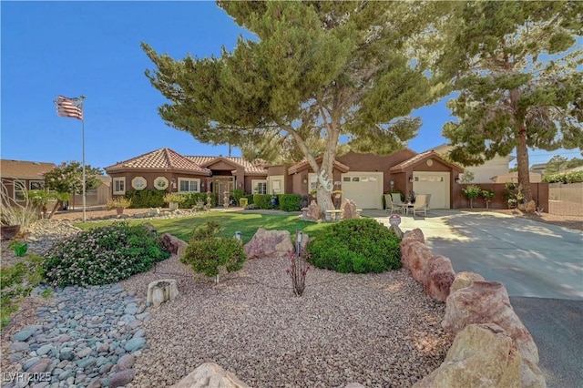 5725 N Durango Dr, Las Vegas, NV 89149 - view of front of property featuring concrete driveway, stucco siding, and an attached garage