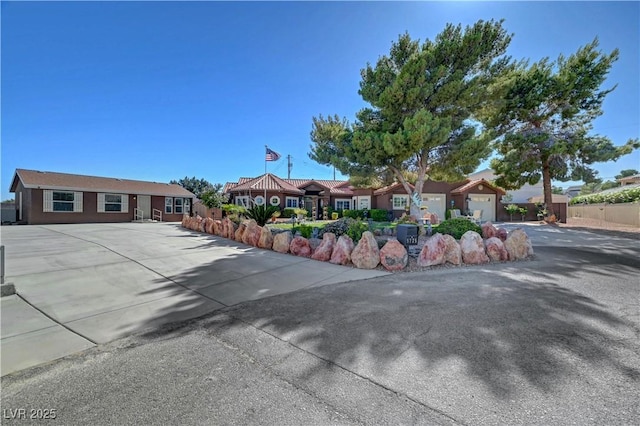 5725 N Durango Dr, Las Vegas, NV 89149 - single story home with driveway, a residential view, and an attached garage