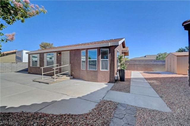 5725 N Durango Dr, Las Vegas, NV 89149 - view of front of property with a patio, a fenced backyard, and stucco siding