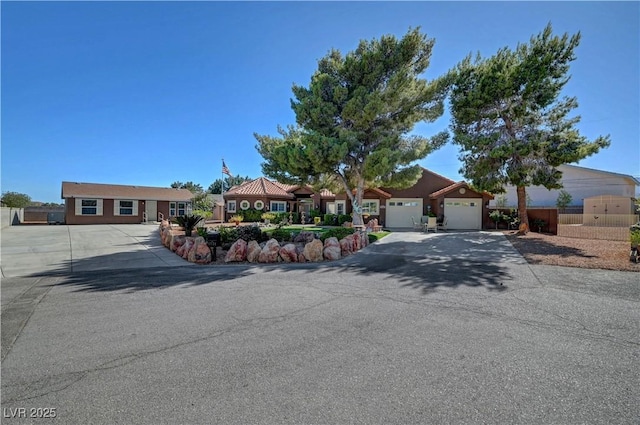 5725 N Durango Dr, Las Vegas, NV 89149 - view of front facade with driveway and an attached garage