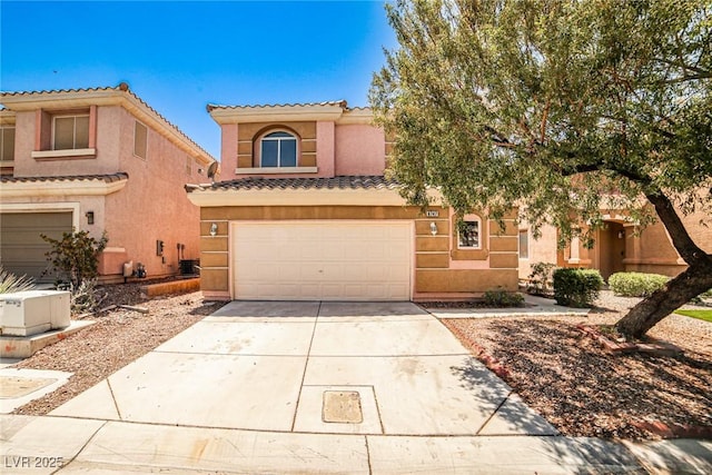 6747 Gold Yarrow St, Las Vegas, NV 89148 - view of front of property featuring a tile roof, concrete driveway, a garage, and stucco siding